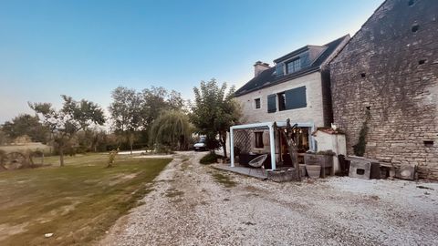 In our agency EXPERTIMO, come and discover this renovated exposed stone house overlooking a beautiful flat garden of 2390 m2 bordered by a small stream. This house also includes a large exposed stone barn used as a garage with a finished floor above ...