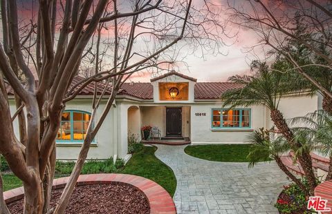 Introducing an exquisite Spanish-style 5BD/4.5BA residence nestled in the prestigious Royal Oaks neighborhood of Encino. Set on nearly half an acre of land, this expansive estate boasts captivating views of the valley and mountains. Upon entry, you a...