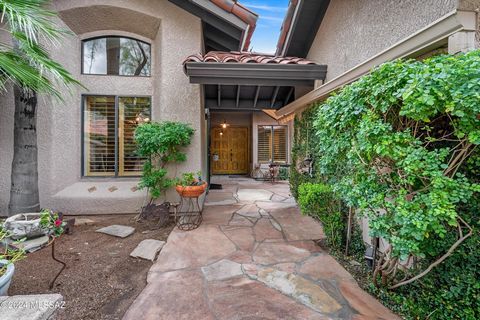 Stunning townhome in prestigious Ventana Canyon Estates with incredible sunset and golf-course views, extending to city lights. Newly remodeled of the highest quality. Gourmet kitchen features quartz counters with waterfall accent, new gas cooktop, d...