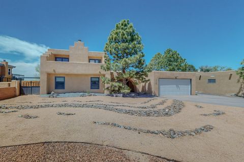 Nestled in Four Hills, Albuquerque, this warm 3,500+ sq/ft offers an open and refined living space. Boasting 4 bedrooms (3 with private ensuites!) and an add'l room that can be an office or bedroom. The heart of the home features a recently updated k...