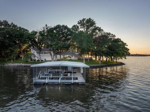 Rare opportunity to purchase an exquisite lake home on an estate lot on Lake of the Ozarks. When families own homes like these they rarely sell them. Perfectly situated private street leading to a flat, point lot and 310 feet of the most beautiful la...