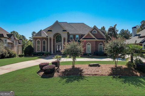 Welcome to a magnificent lakefront estate that exudes regal splendor. With stately columns, a circular driveway, and impeccably landscaped grounds, this residence is a true masterpiece. Spanning approximately 10k square feet, this home offers 7 bedro...