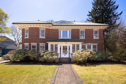 This stunning 11-room brick Georgian residence, with over 3,835 square feet of living space, is set on a beautiful tree-lined street near Coolidge Corner. Windows abound allowing for tremendous sunshine. Notable features including period details, 9' ...