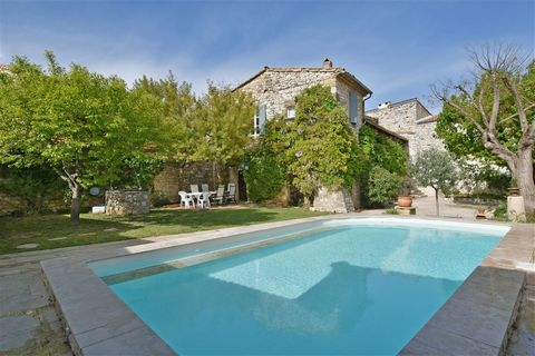 This charming stone village house of approx. 213m2 is located in a very quiet area with a private garden and swimming pool. The ground floor has a vaulted living room of about 45m2 opening onto the garden, a separate kitchen of about 17m2 opening ont...