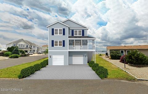 Immerse yourself in waterfront luxury at this new construction on Cedar Island Drive, Brick, NJ. Completion slated for October 2024, this expansive home boasts 5 beds, 4.5 baths, spanning 3,300+ sqft. Take in stunning views of Barnegat Bay from the 2...