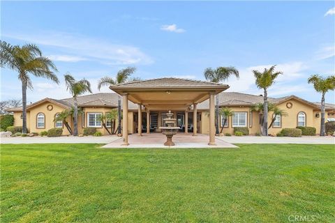 Experience true elegance in a relaxed setting in this expansive true single story estate boasting 5160 square feet. This 5.19 acres offers both beautiful views and usable land to accommodate equestrian needs, vineyard or guest house. The gated entry ...