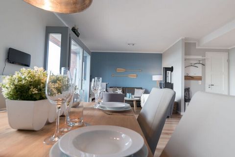 The light-flooded holiday apartment is on the 1st floor, with a direct view of the inland lake, marina, city and Baltic Sea. Through the open hallway you reach the living/dining room, with the fully equipped kitchen, the dining room table, a music sy...