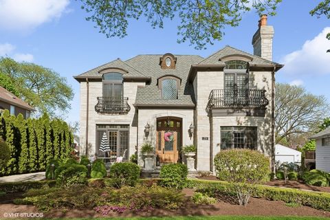 Indulge in unparalleled luxury living in Elmhurst. This custom-built masterpiece showcases exquisite craftsmanship, refined elegance, and a lifestyle of sophistication. Boasting over 7,400 square feet of meticulous design on four finished levels. Thi...