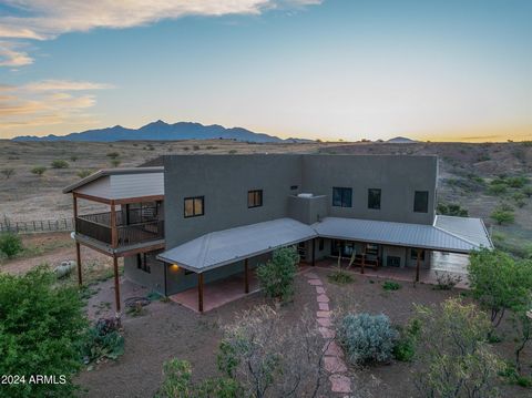 Discover the ultimate equestrian's paradise with this stunning off-grid 20 acre estate. This unique estate is nestled amidst breathtaking 360-degree panoramic mountain views overlooking the Santa Rita, Empire, Whetstone, Mustang and Huachuca ranges a...