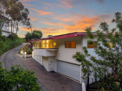 First time on the market in almost 4 decades! Nestled high upon a private road within the celebrity enclave of the renowned Hollywood Hills, discover your mighty and magical home on the coveted Torreyson Drive. This blank canvas, just off the famed M...