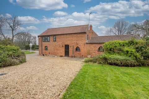 Just inland from golden sandy beaches, this barn enjoys an idyllic setting. You make your way down the quiet, leafy lane, turn down the drive, past the wildlife pond, and the pretty red brick and boarded barn will come into view. Enormously appealing...