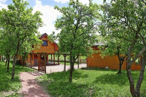 Two cozy wooden houses, just 100 meters from Lake Wicko on the Stettiner Haff and a few kilometers from the beautiful beach on the Baltic Sea in Miedzyzdroje. Both holiday homes have a fireplace and a large covered terrace and are very cozy due to th...