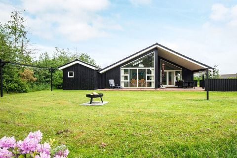 Holiday cottage located in the exciting area of Tranum Strand on a large, open plot. The decor is light and modern with open concept kitchen and living room, three good bedrooms and a mezzanine, large bathroom with whirlpool and sauna and a guest toi...