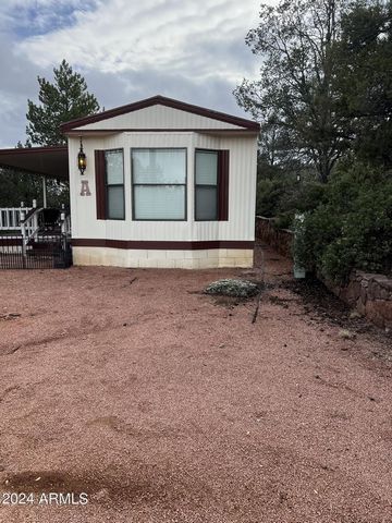 Owner/Agent This 1.75 Acre Property currently has 2 single wide mobile homes on it. Great views Hillside lot. All utilities on property. Including a 220 and sewer hook up for a motor home or charging your electrical vehicle. The West home A was remod...