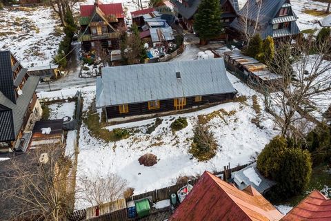 Wooden highlander's house in Zakopane, in the center at Kościeliska Street. It is one of the oldest and most beautiful streets in Zakopane, which connects with Krupowki. On the plot, a decision of the City of Zakopane on the Development Conditions wa...