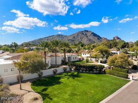 The best priced, fully remodeled home in the heart of Paradise Valley! Breathtaking views of Camelback Mountain from this dual gated, single level estate will make you fall in love! Stunning remodel just completed in 2023, this acre plus estate, is p...