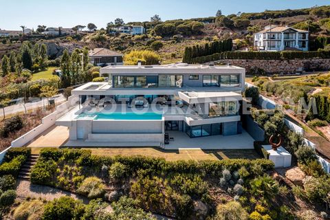 Experience Mediterranean Exclusivity in this Spectacular Property. Discover a modern 5 bedroom villa for sale in Sotogrande, offering a sophisticated lifestyle with panoramic sea and golf course views. Invest in your comfort today with GADAIT Interna...