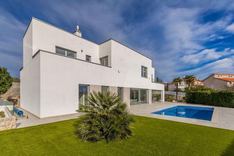 Impressive modern villa in Krk with breathtaking sea views, just 500 meters from the sea! Total floorspace is 400 sq.m. Land plot is 761 sq.m. Villa was built in 2016. There are three levels. In the basement there is a toilet, boiler room, storage ro...