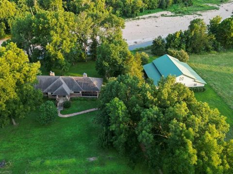 Waterfront access to Big Sugar Creek! The 23.5+/- acre property is conveniently located 20 miles from Northwest Arkansas on paved roads. In 2012 the 1600 sq ft home was built using insulated concrete forms providing exceptional energy efficiency, and...