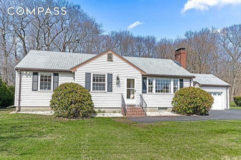 Charming three-bedroom ranch on spectacular 20,000sf west side lot abutting conservation! The updated granite kitchen with newer appliances leads to the open concept dining room overlooking the beautiful, private yard. The spacious living room featur...