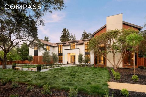 New construction home redefines modern luxury with organic materials, soaring scale, and cutting-edge design. Sculptural lighting installations and designer touches throughout. Walls are finished in rich textures of wood, while granite-framed doorway...