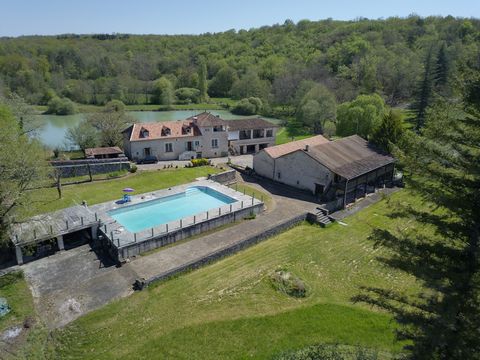 Imposing stone property with guest house, annex, outbuildings and swimming pool surrounded by a crescent shaped artificial lake on a preserved valley with meadows and woodland of 88 hectares. Here several springs feed all year round a running stream....