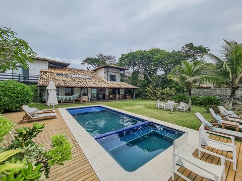 Built on flat land with a total of 1,600m² and 450m² of built area, facing the sea and in the most coveted strip of Manguinhos! This beautiful two-story property includes 07 (seven) suites and one more bedroom, 8 bathrooms, large spaces, integrated l...