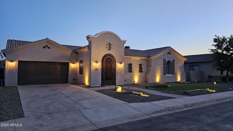This is it! EVERYTHING YOU ASKED FOR: a 4-car garage, a sparkling pool, gated courtyard, modern flooring, & an upscale kitchen—all waiting for you. RIGHT WHERE YOU WANTED TO BE: Conveniently located just a 5-minute drive from Loop 202, with an extra ...