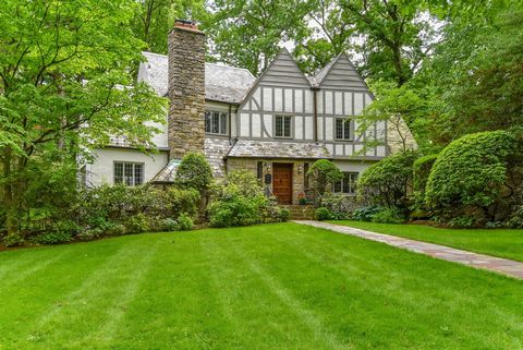 This spacious Tudor sits on .41 of an acre of beautiful park-like property. Located in the Larchmont Woods area of New Rochelle, just minutes from the Village of Larchmont, town and Metro North. This gracious home has seven bedrooms and four and a ha...