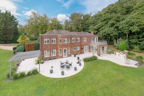 A stunning Georgian-style detached family residence nestled of a private road, set behind automated gates and surrounded by impressive grounds of just under one acre, with mature established trees offering seclusion and privacy.  Woodhurst Heights da...
