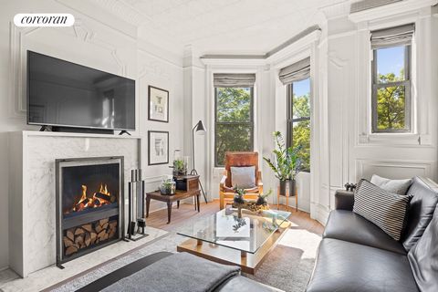 In the heart of Park Slope, ONE BLOCK from Prospect Park, with its own ROOF DECK, a working WOODBURNING FIREPLACE and a renovated kitchen and bath, this airy two-bedroom, one-bath coop offers great space with a flexible layout , combining classic cha...