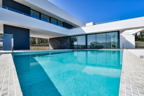 Impressive modern luxury villa with sea views for sale in Javea. Impressive modern luxury villa in a prime location with sea views. The property offers an open view of the green hills up to the sea. On a clear day you can look out over the Mediterran...
