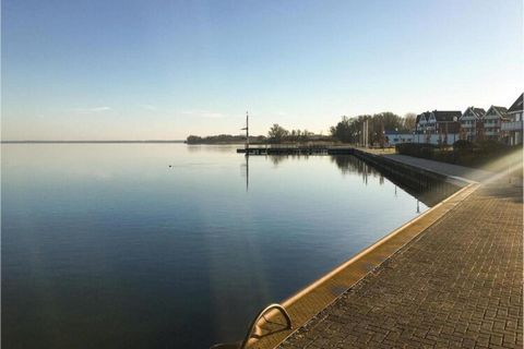 Tucked within the peaceful harbor village of Rechlin, this inviting apartment for four guests offers direct access to Müritz—Germany’s “Little Sea.” The holiday park features its own lido and forms a seamless unit with the protected Marina Müritz, ma...