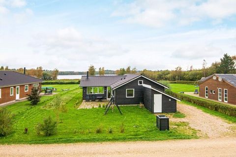Child-friendly cottage with space for two families located in a family-friendly area and with an impressive panoramic view of Kvie Lake. The cottage is built in the best materials and with many good details. There are wooden floors in all rooms as we...