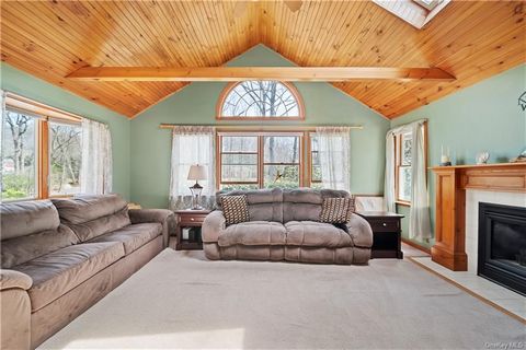 Welcome to this beautiful log cabin ranch nestled on 1 acre of serene property in Miller Place. This stunning home boasts a warm and inviting ambiance, featuring ski chalet vibes throughout. The home offers a spacious primary suite, perfect for relax...