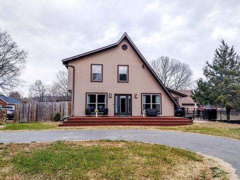 Beautiful, unique, completely remodeled home with huge main bedroom suite upstairs with office, granite countertops, stainless appliances, large dining room & granite serving bar, laundry room and tons of storage. New in 2017 - roof, HVAC, Low-E wind...