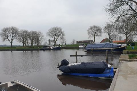 This spacious holiday home in Friesland has a cosy interior, a beautiful location, a boat and a jetty. Ideal for the holidaymaker who likes to explore the Frisian waters! It is an excellent choice for restful holidays with the family. There are numer...