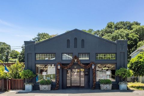 This charming stucco and tin structure has been a successful commercial location since 1918. Its current incarnation is the classy French Salvage Antique Store. Their move is your gain. The ceilings in the front section of the building are 12 feet ta...
