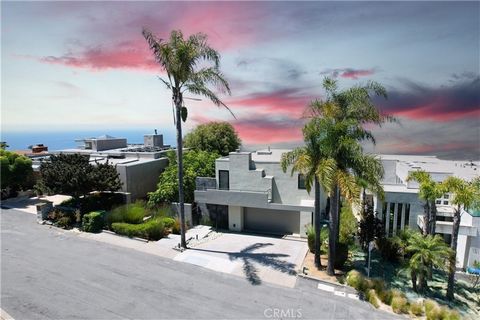 Perfectly positioned home located on lower La Mirada Street in the center of beautiful Laguna Beach. La Mirada is a one way in and one way out street providing that feeling of a quiet family affair. It absolutely feels like a private quiet small comm...