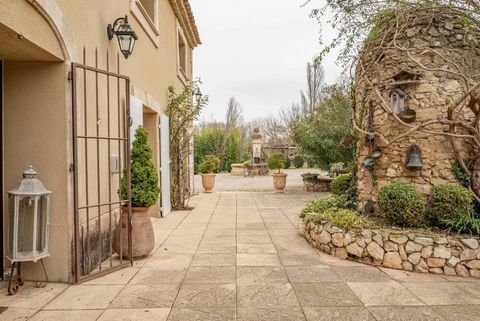 Under the gentle glow of Provence, in a charming village at the heart of Bouches-du-Rhone and on the outskirts of the majestic Alpilles mountains, discover this magnificent property. Nestled on a 1.6-hectare plot, this residence spanning approximatel...