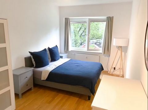 There are 3 bedrooms in this apartment. Each bedroom is equipped with a king-sized bed with fine bedding, two bedside tables, a floor lamp, modern art, an armchair, a chest of drawers, a large closet with a mirror, and a working desk with a correspon...