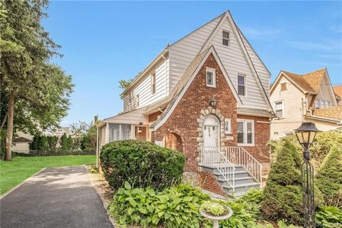 Welcome to this charmingly renovated 3-bedroom, 1.5-bath Tudor nestled in the Kimball area of Yonkers, boasting an oversized lot. As you step into the entry hall, you're greeted by a spacious Living Room featuring a cozy fireplace and adorned with cu...