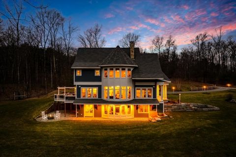 Welcome to 7 LoveJoy Lane, a home that feels like it was designed from the pages of a fairytale and brought to life with craftsmanship and timeless design. Nestled just off scenic Richardson Rd in one of Hollis' most cherished settings, this custom-b...